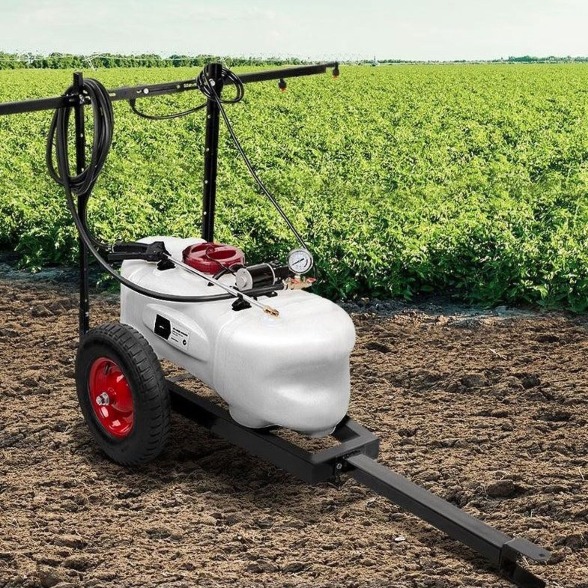 Farm sprayer on a field with green crops in the background - 100L Weed Spray/Fertiliser Trailer