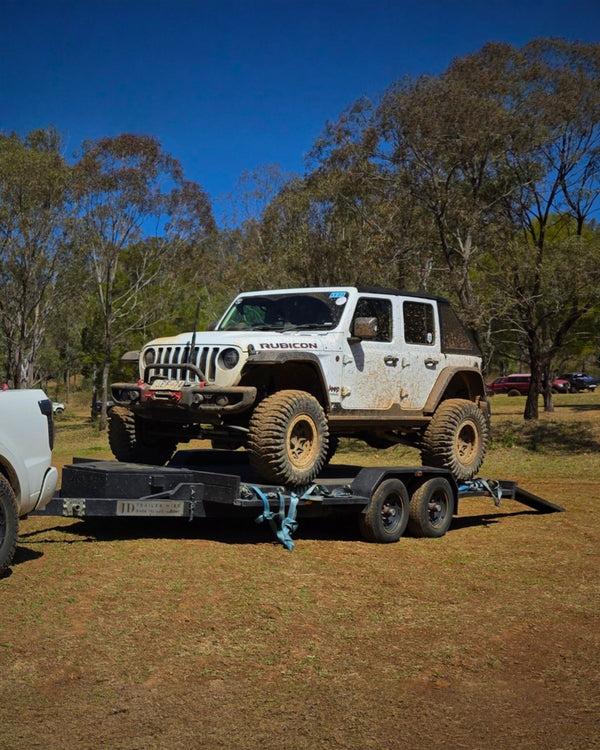 4WD on a car trailer hire ready for off-road recovery in Brisbane