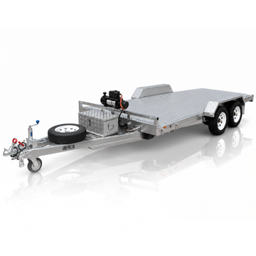 A silver aluminum flatbed car trailer with a diamond plate deck, dual rear wheels, a front hitch, a spare tire mounted on the tongue, and a small engine and storage box on the bed, shown on a white reflective studio background.